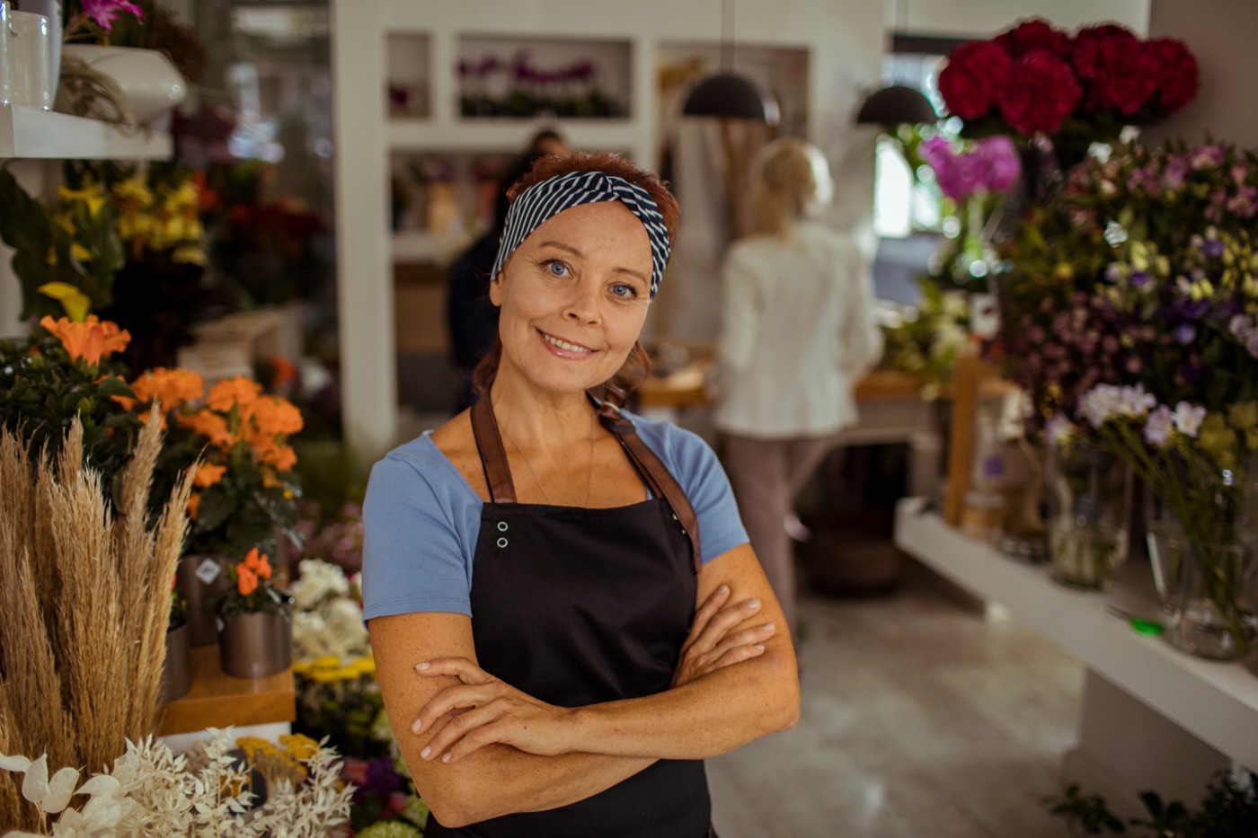 A florist arranging flowers in their Toronto shop